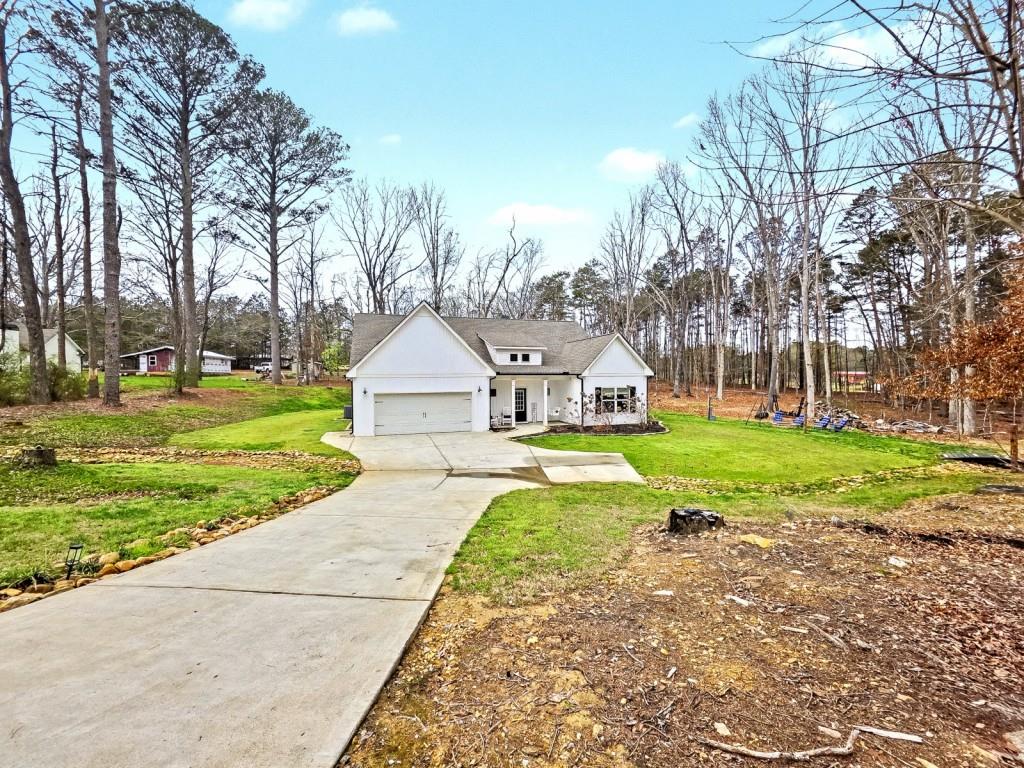 453 Mulberry Rock Road Temple, GA 30179 - Photo 4 of 35 a front view of a house with yard and green space