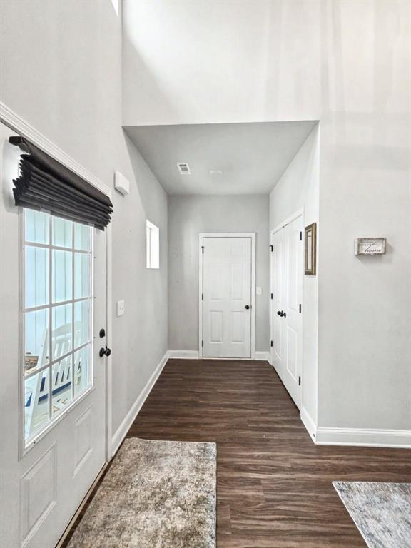 453 Mulberry Rock Road Temple, GA 30179 - Photo 5 of 35 a view of a hallway with wooden floor and windows
