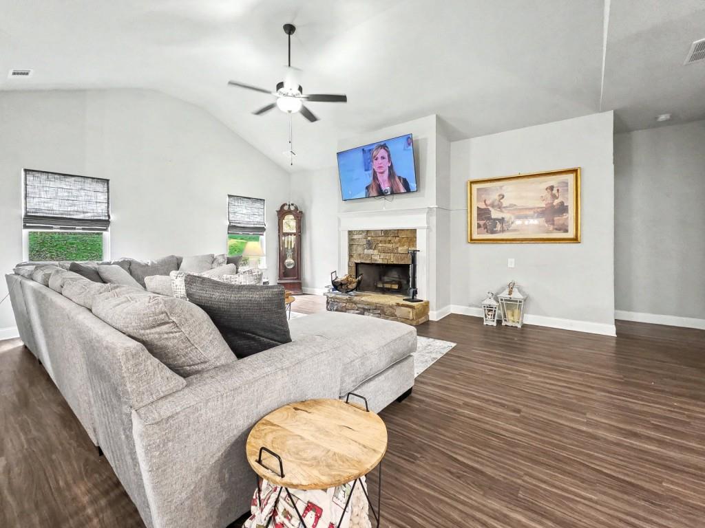 453 Mulberry Rock Road Temple, GA 30179 - Photo 9 of 35 a living room with furniture and a fireplace