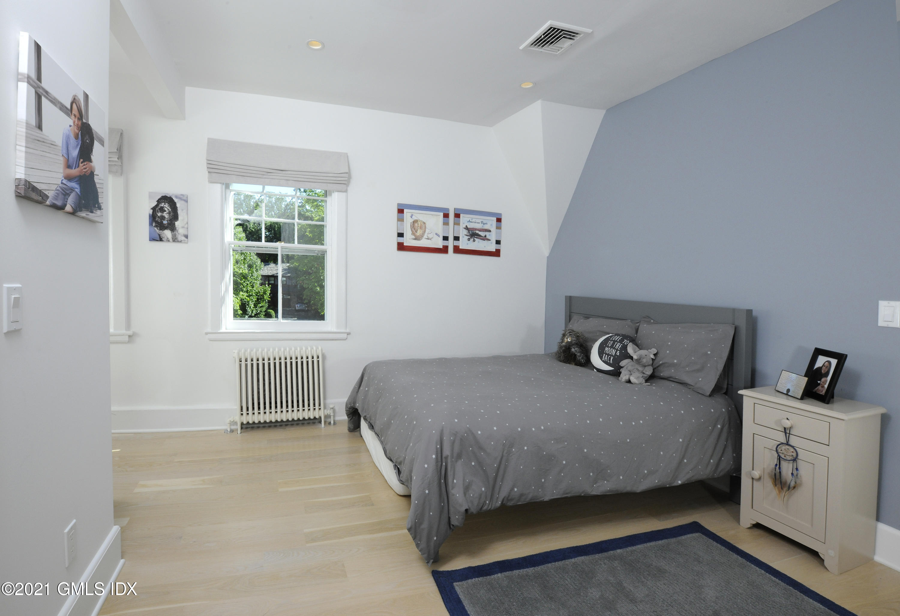 12 Binney Lane Old Greenwich, CT 06870 - Photo 15 of 28 a bedroom with a bed and a window