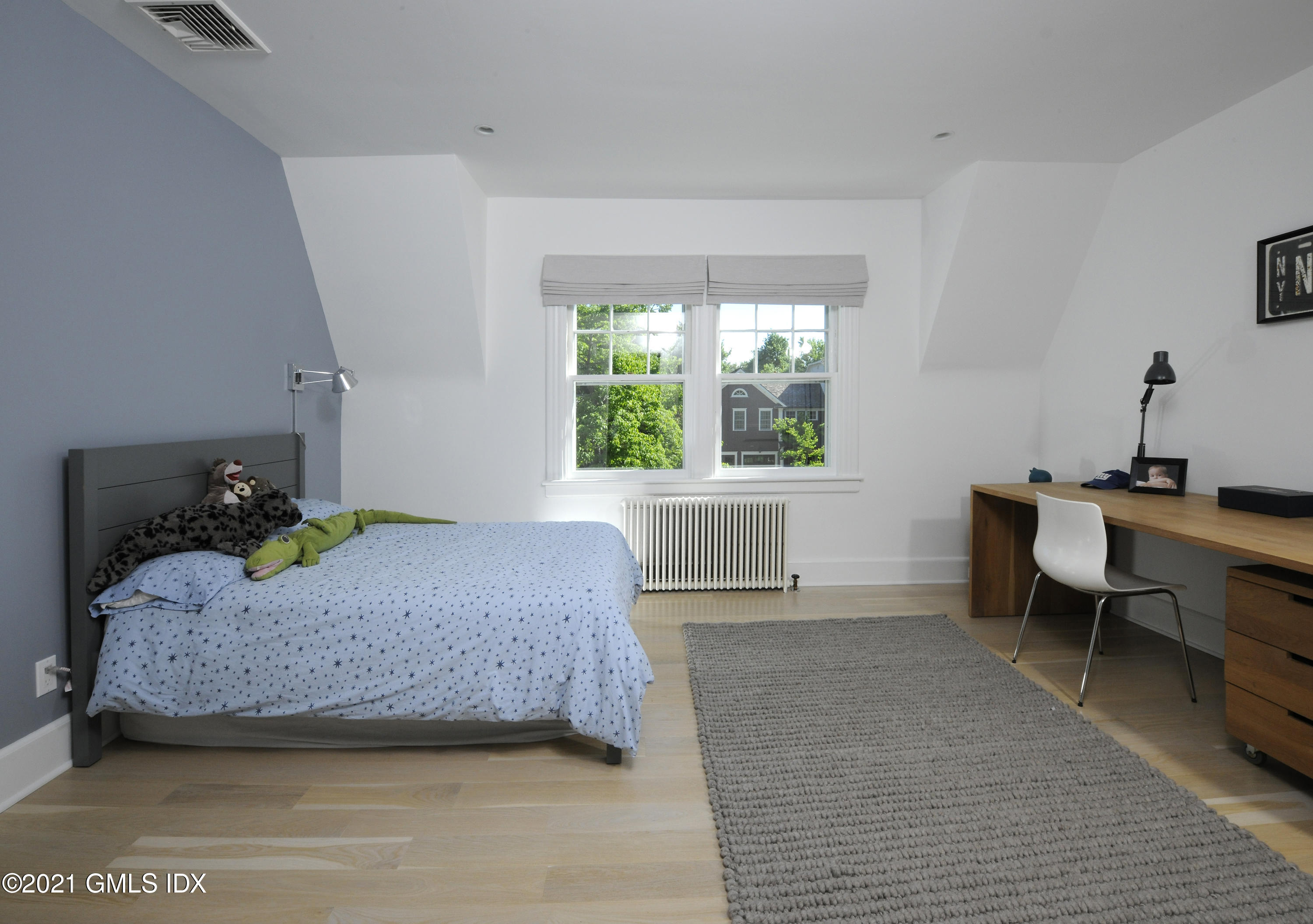 12 Binney Lane Old Greenwich, CT 06870 - Photo 16 of 28 a bedroom with a bed and a window