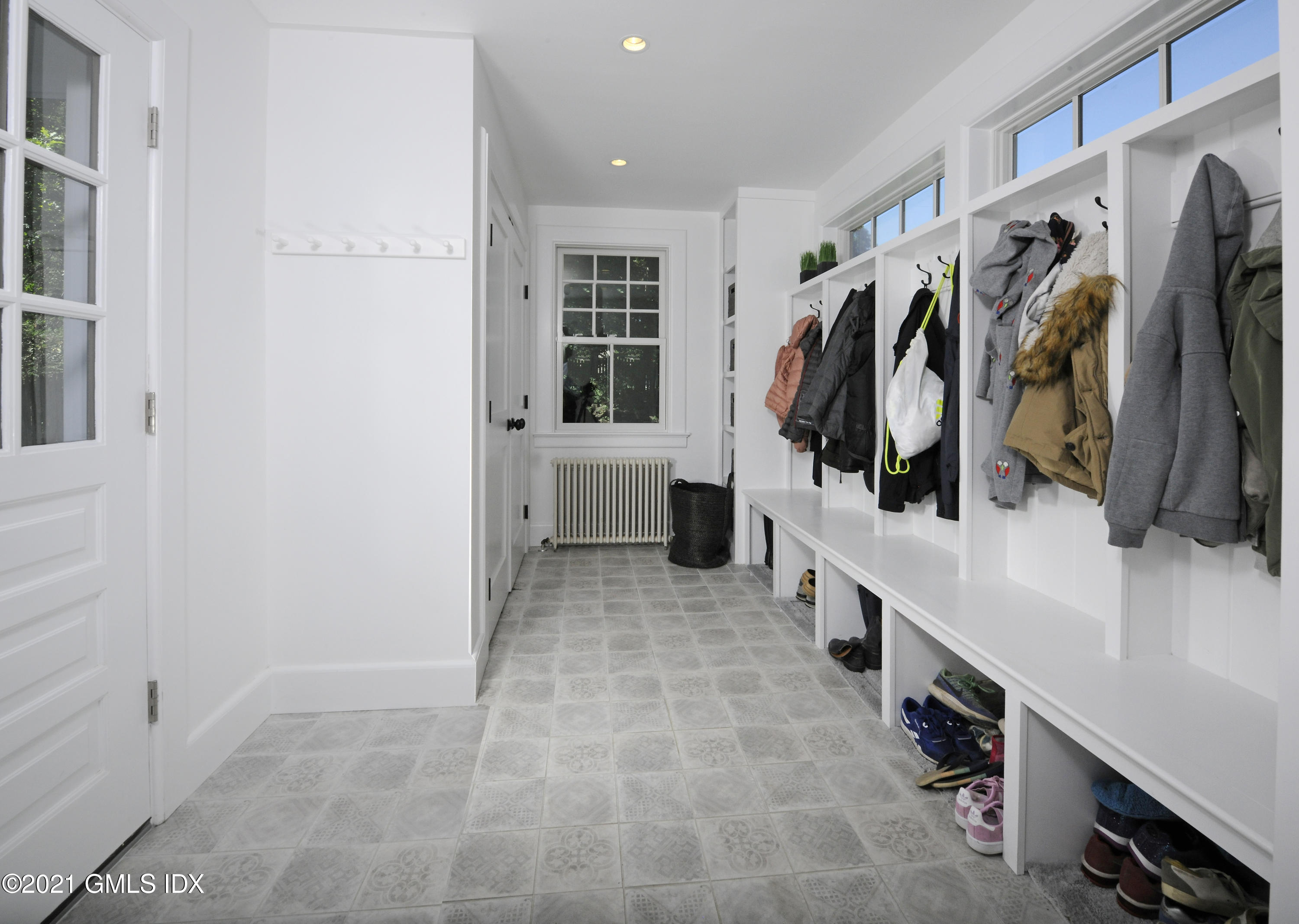 12 Binney Lane Old Greenwich, CT 06870 - Photo 20 of 28 a view of walk in closet with clothes and shoes