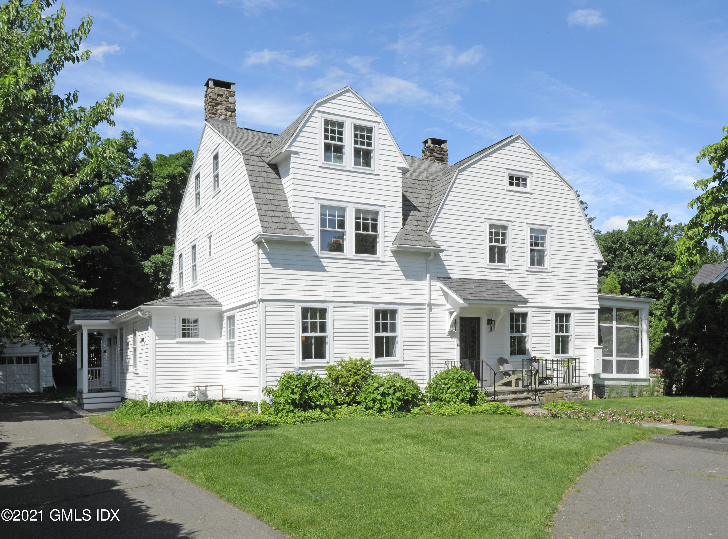 12 Binney Lane Old Greenwich, CT 06870 - Photo 2 of 28 a front view of a house with a yard