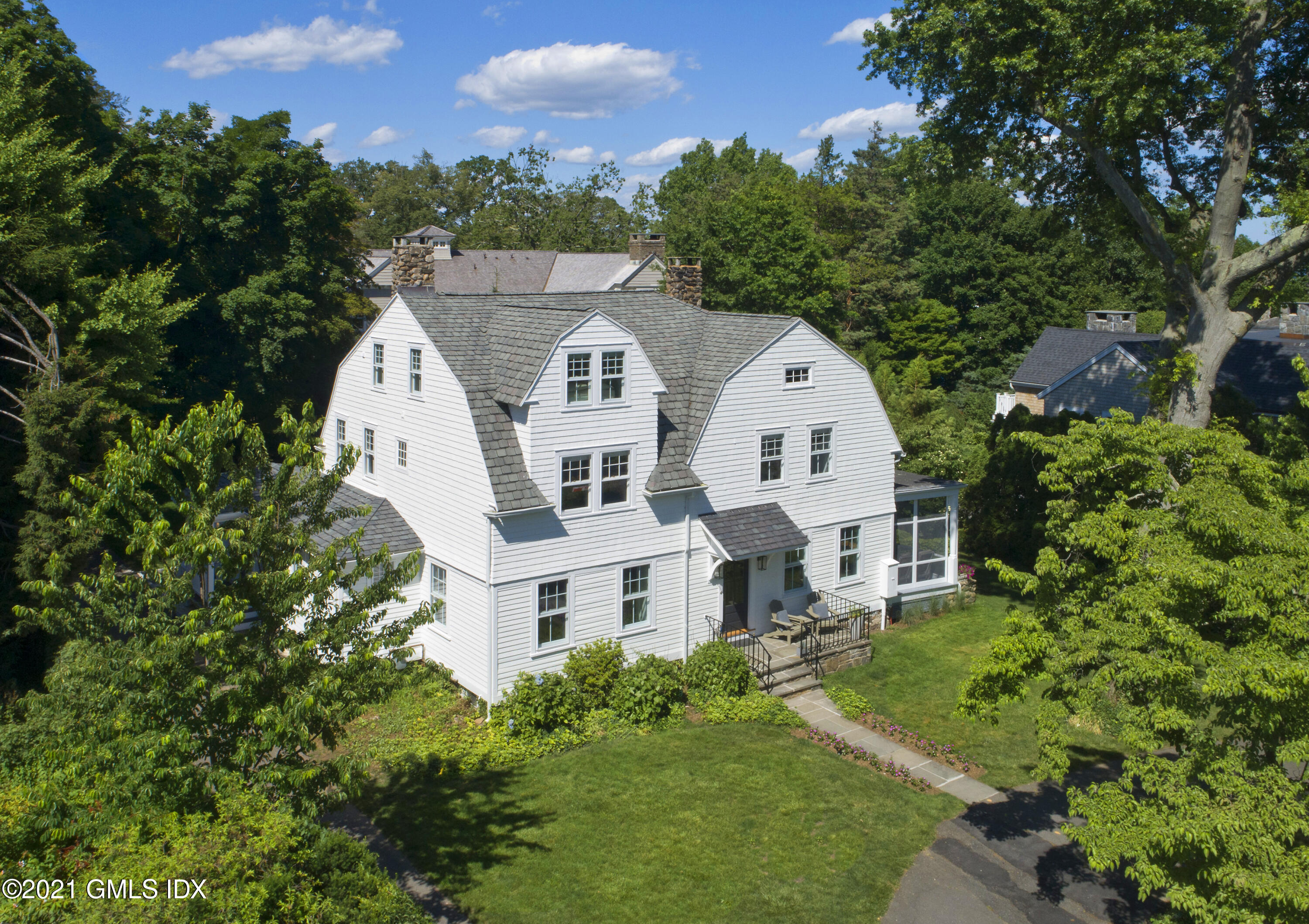 12 Binney Lane Old Greenwich, CT 06870 - Photo 28 of 28 a view of white house with a yard and potted plants
