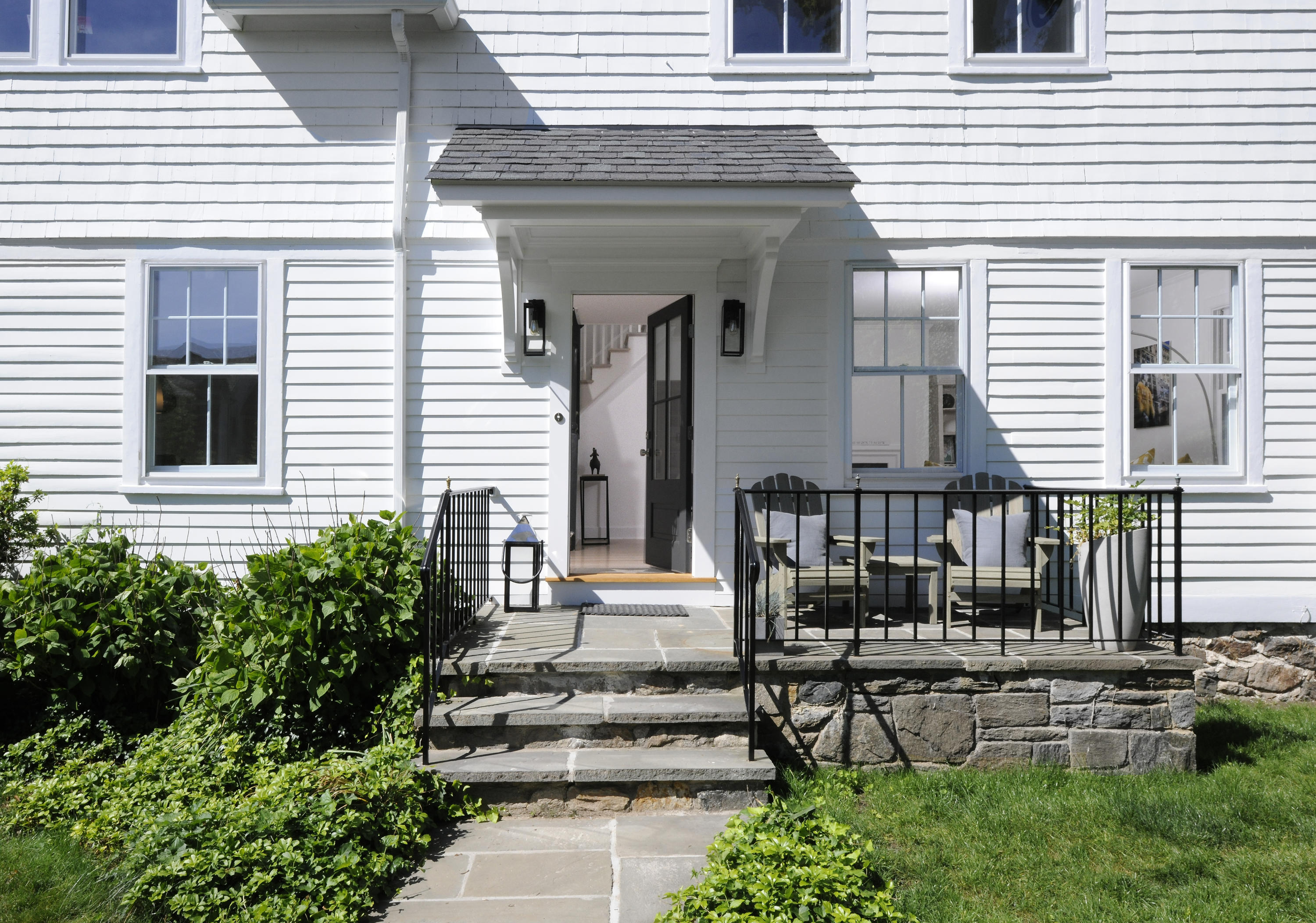 12 Binney Lane Old Greenwich, CT 06870 - Photo 3 of 28 a view of a house with large windows and plants