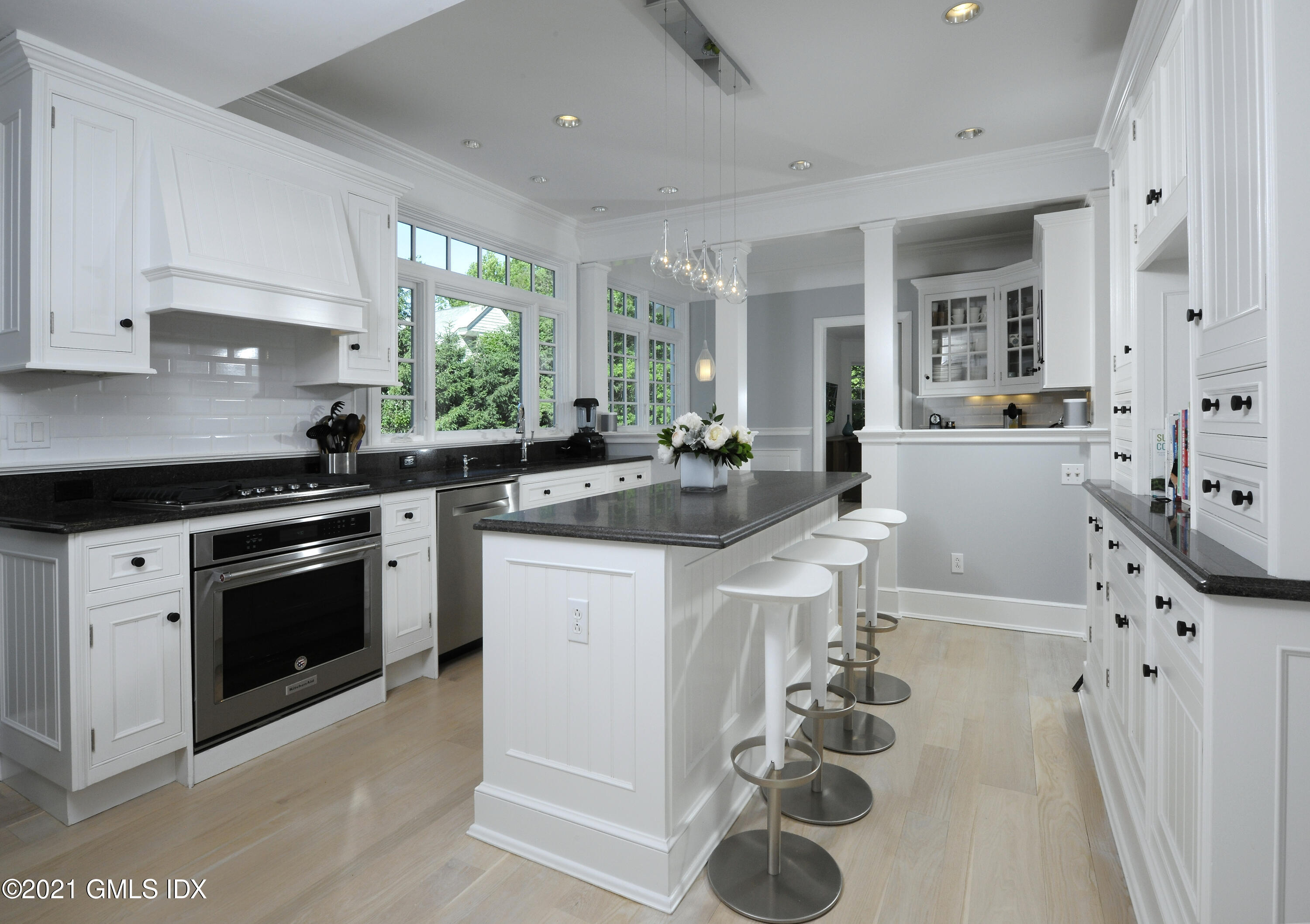 12 Binney Lane Old Greenwich, CT 06870 - Photo 10 of 28 a kitchen with granite countertop a sink stove and cabinets