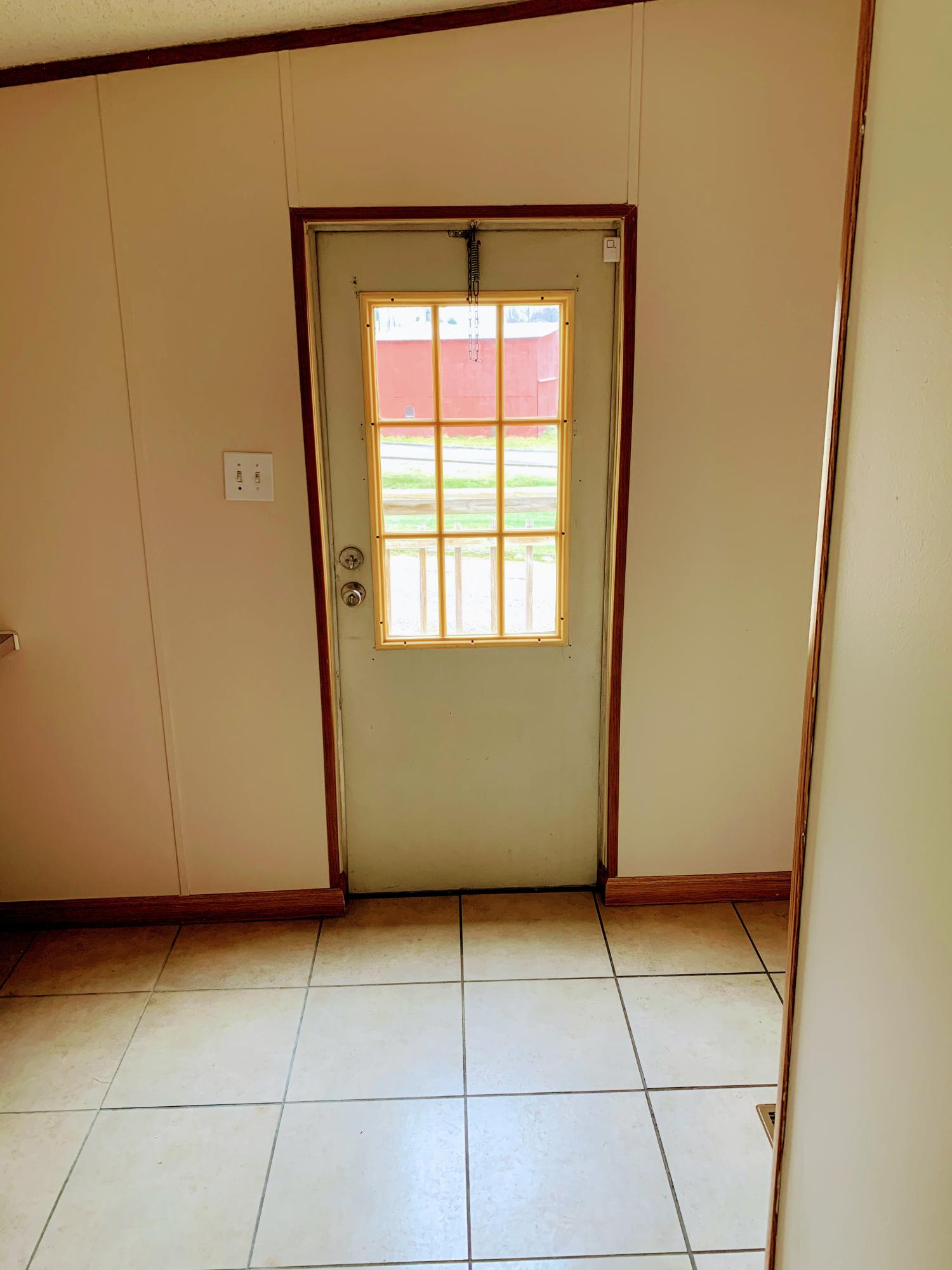 260 Quillen Shell Road Greeneville, TN 37745 - Photo 15 of 32 Laundry room to side door
