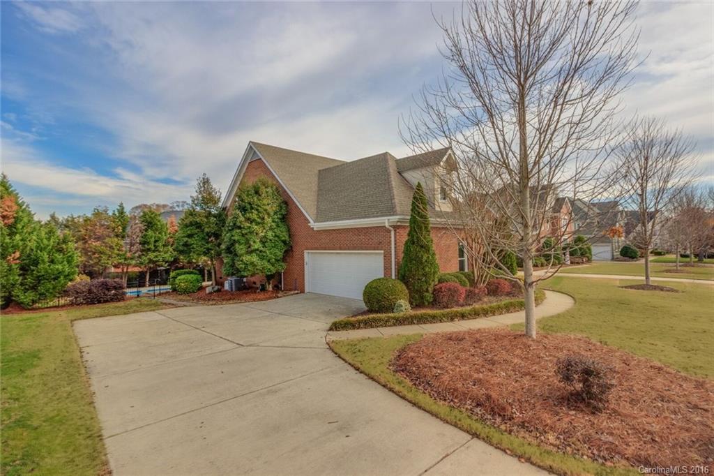 166 Lake Pointe Drive, Unit 122 Fort Mill, SC 29708 - Photo 3 of 22 a view of a house with a yard and large tree