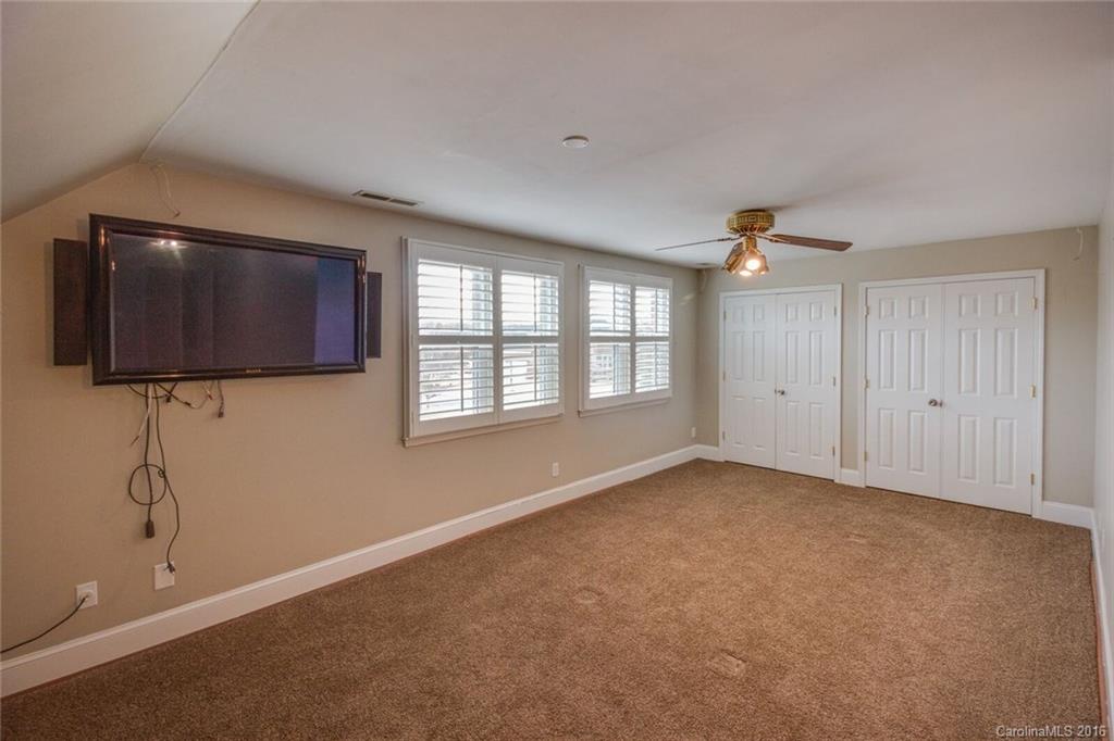 166 Lake Pointe Drive, Unit 122 Fort Mill, SC 29708 - Photo 22 of 22 a view of an empty room with a window and a flat screen tv
