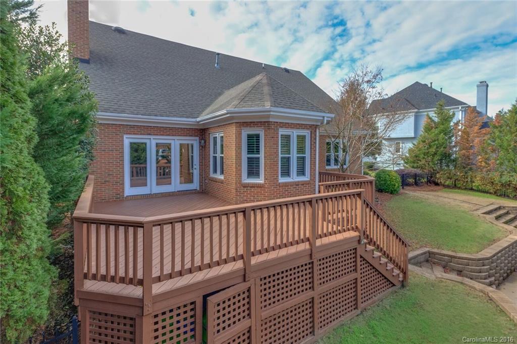 166 Lake Pointe Drive, Unit 122 Fort Mill, SC 29708 - Photo 5 of 22 a view of a house with a wooden deck