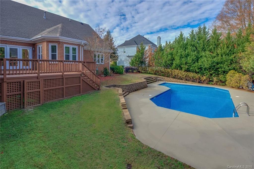 166 Lake Pointe Drive, Unit 122 Fort Mill, SC 29708 - Photo 6 of 22 a view of a house with a swimming pool