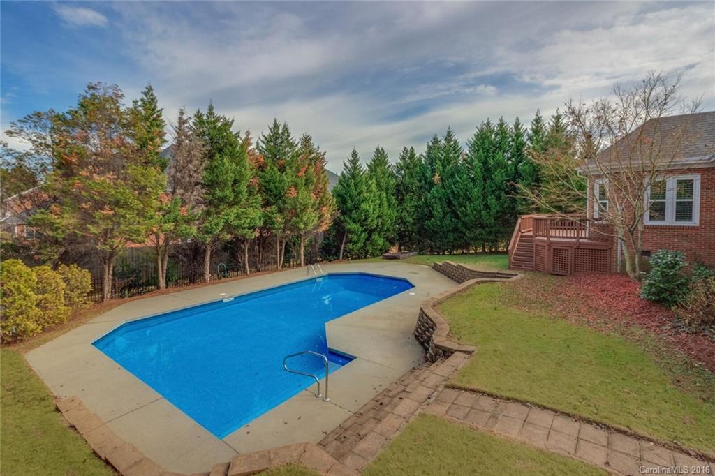 166 Lake Pointe Drive, Unit 122 Fort Mill, SC 29708 - Photo 7 of 22 a view of a swimming pool with an outdoor seating and a yard