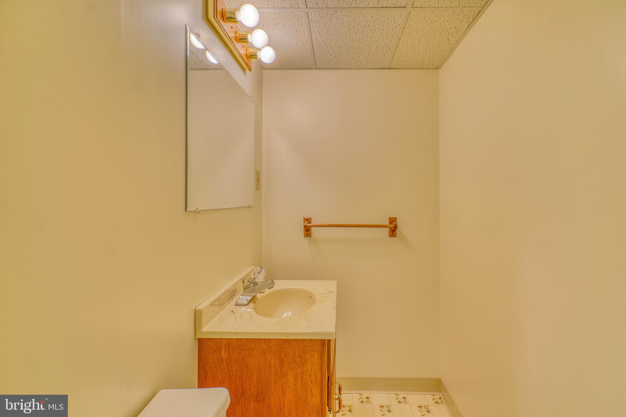 1137 Layton Road Philadelphia, PA 19115 - Photo 42 of 48 a bathroom with a sink and a mirror