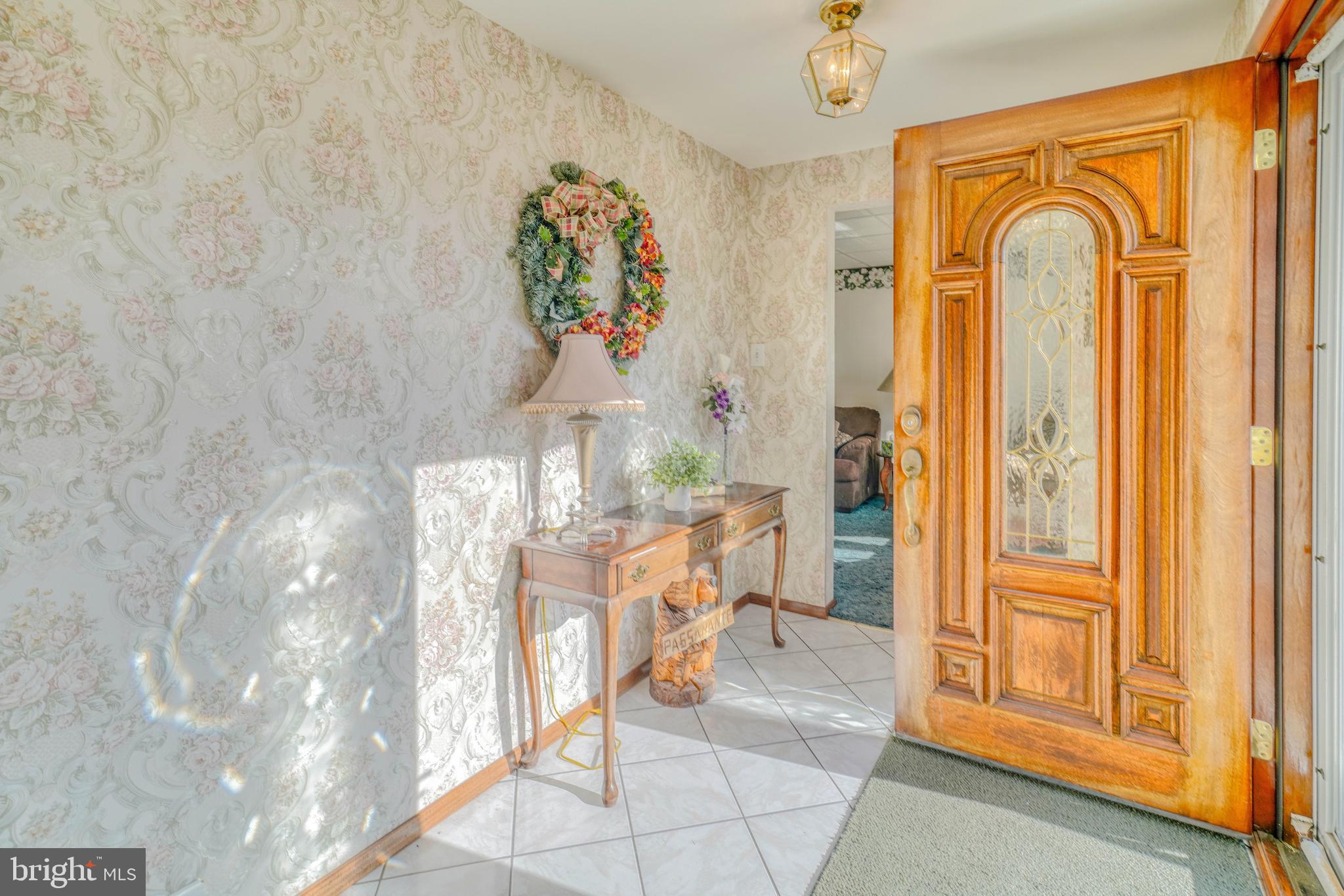 1137 Layton Road Philadelphia, PA 19115 - Photo 5 of 48 a living room with furniture and a window