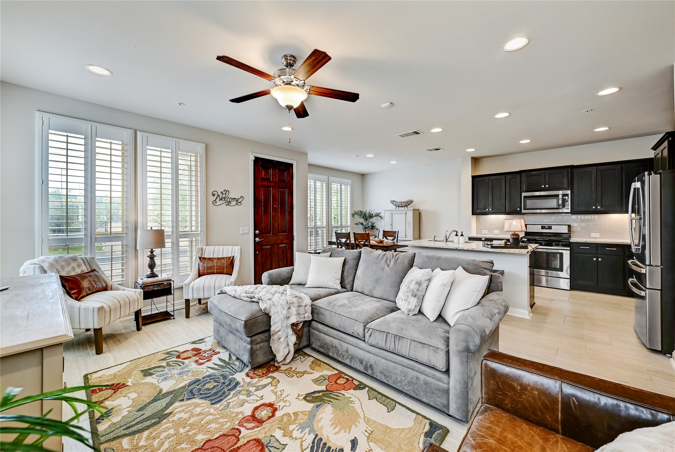 6814 East Riverside Drive, Unit 64 Austin, TX 78741 - Photo 4 of 17 An inviting open-concept living area seamlessly connects to the kitchen, promoting a natural flow for daily living.