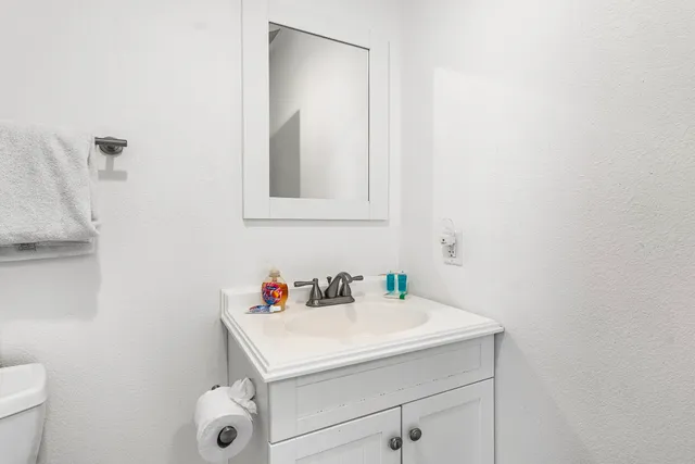 a bathroom with a sink and a vanity