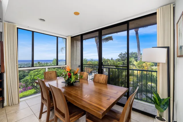 a view of a dining room with furniture window and outside view