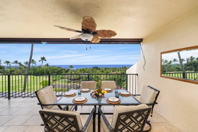 a view of a balcony with lake view and a potted plant