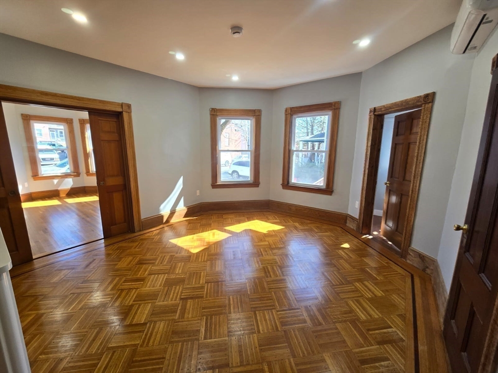 22 Linden Street Reading, MA 01867 - Photo 15 of 32 a view of empty room with wooden floor and fan