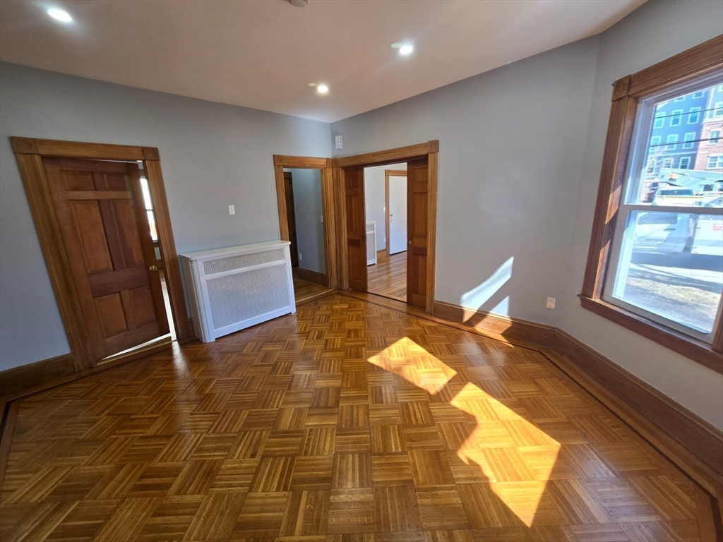 22 Linden Street Reading, MA 01867 - Photo 16 of 32 a view of a bedroom with furniture and window