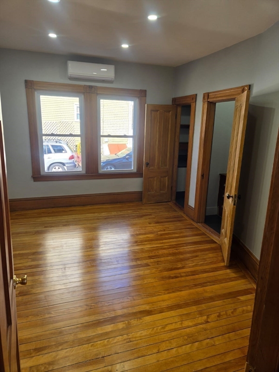 22 Linden Street Reading, MA 01867 - Photo 17 of 32 an empty room with wooden floor and windows