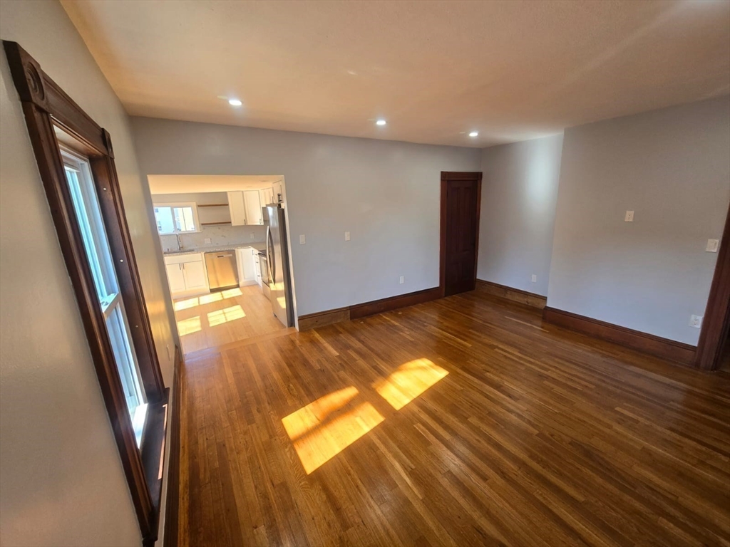 22 Linden Street Reading, MA 01867 - Photo 20 of 32 a view of empty room with wooden floor and fan