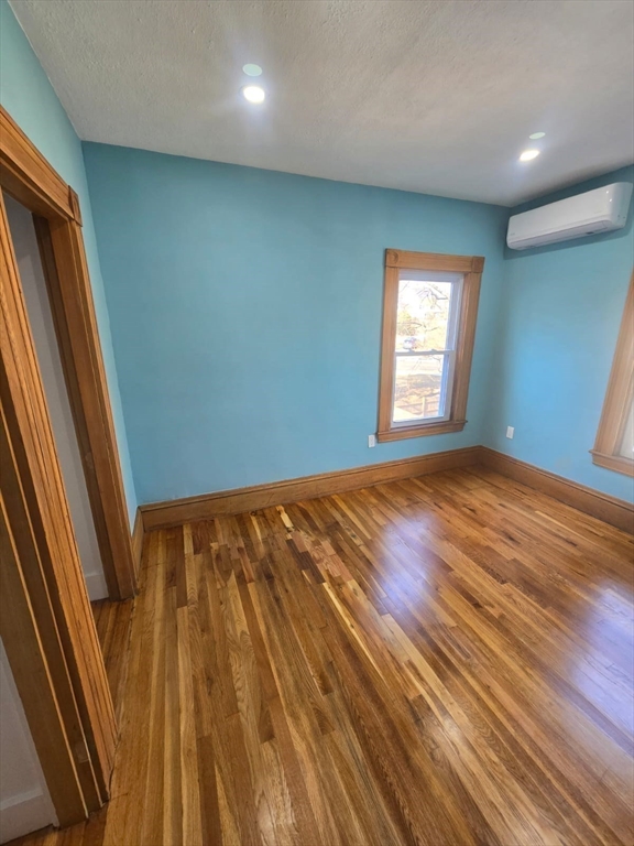22 Linden Street Reading, MA 01867 - Photo 23 of 32 wooden floor in an empty room with a window