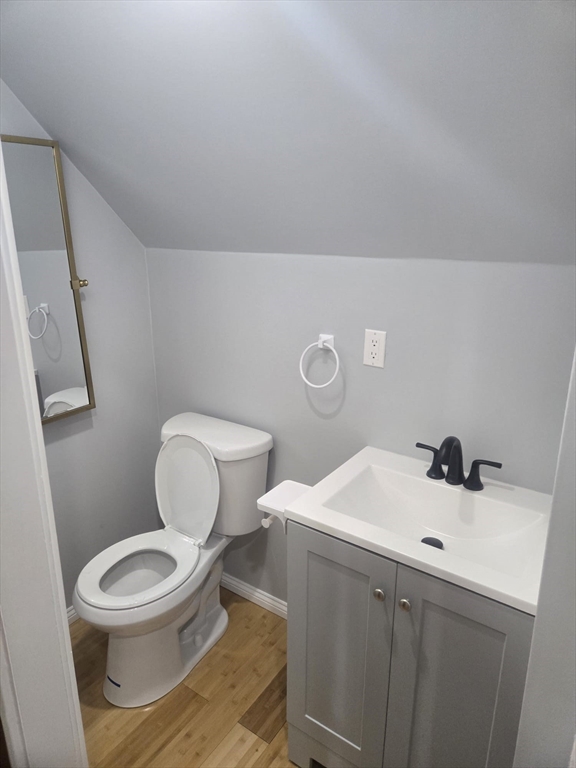 22 Linden Street Reading, MA 01867 - Photo 26 of 32 a bathroom with a toilet a sink and mirror