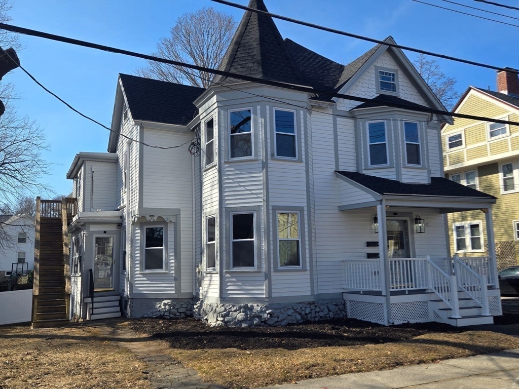 22 Linden Street Reading, MA 01867 - Photo 28 of 32 a front view of a house with a yard
