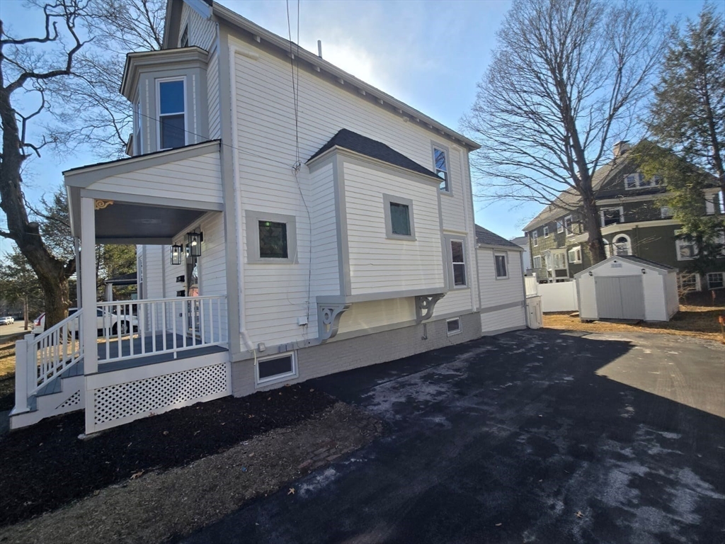 22 Linden Street Reading, MA 01867 - Photo 29 of 32 a house view with a backyard