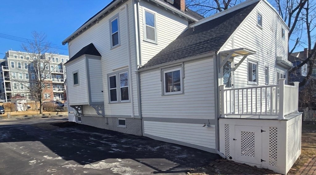 22 Linden Street Reading, MA 01867 - Photo 31 of 32 a front view of a house with a yard