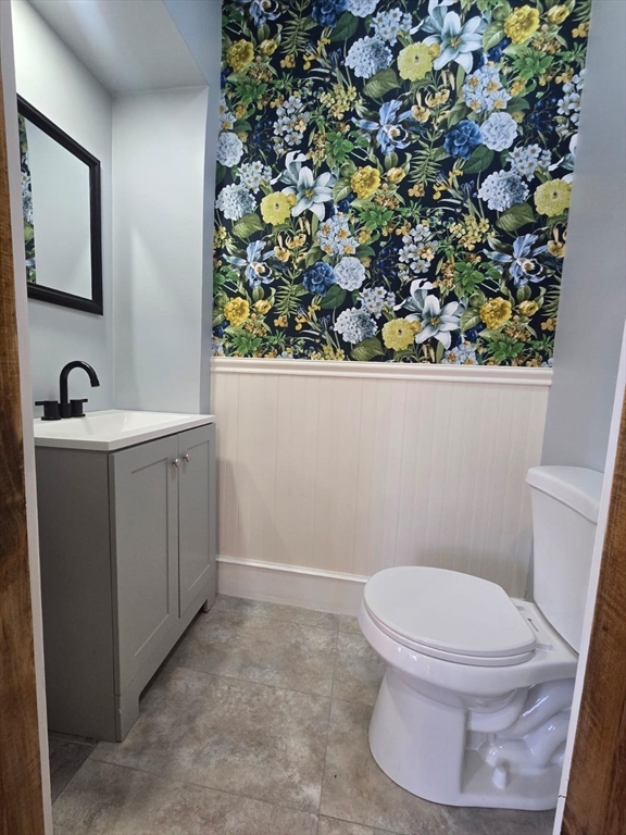 22 Linden Street Reading, MA 01867 - Photo 6 of 32 a bathroom with a sink toilet and mirror