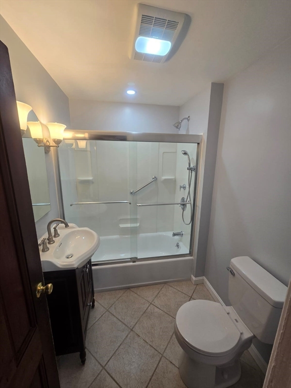 22 Linden Street Reading, MA 01867 - Photo 9 of 32 a bathroom with a sink mirror toilet and shower