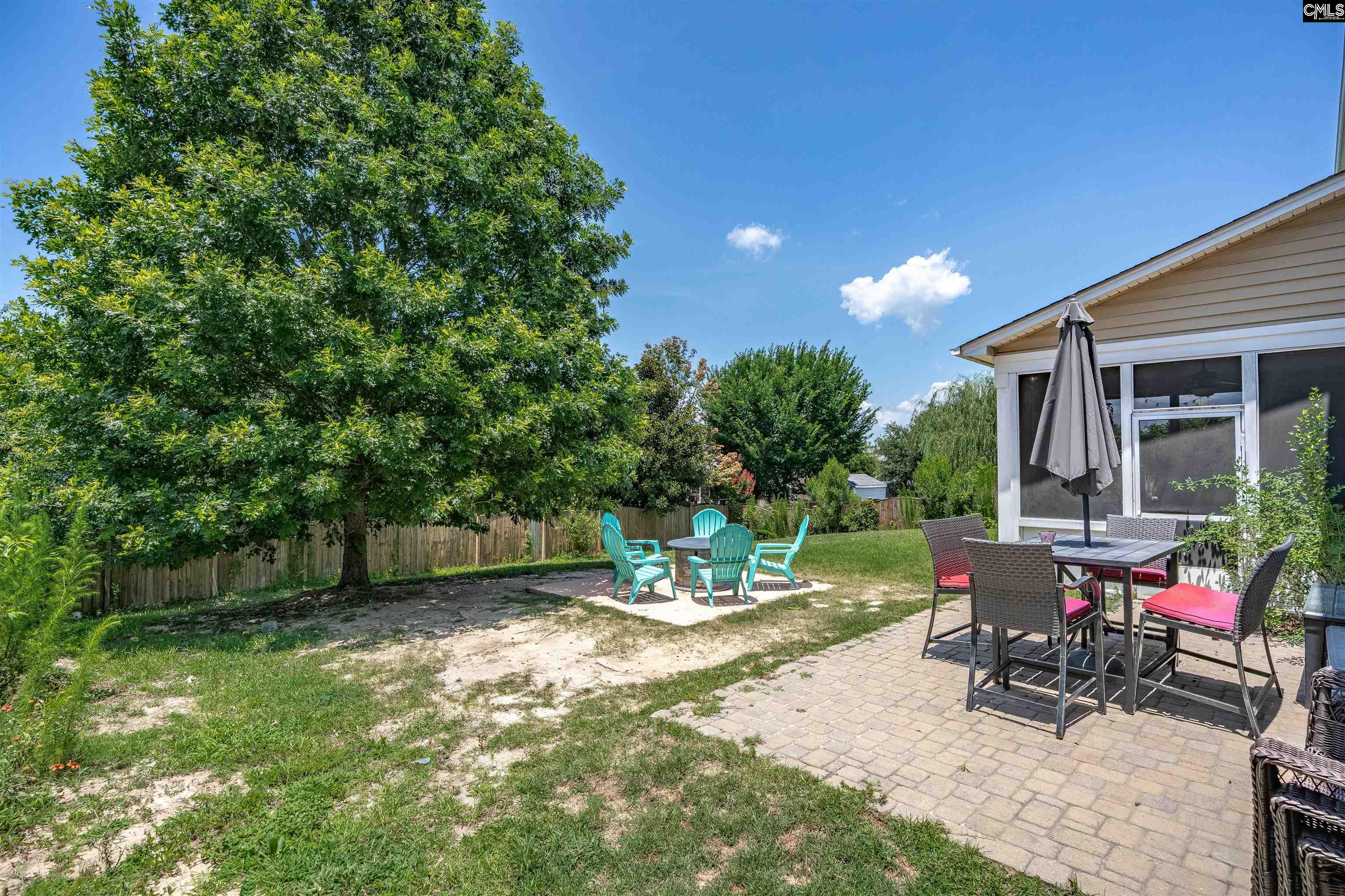 321 Asa Rose Lexington, SC 29072 - Photo 40 of 52 a view of a backyard with sitting area and garden