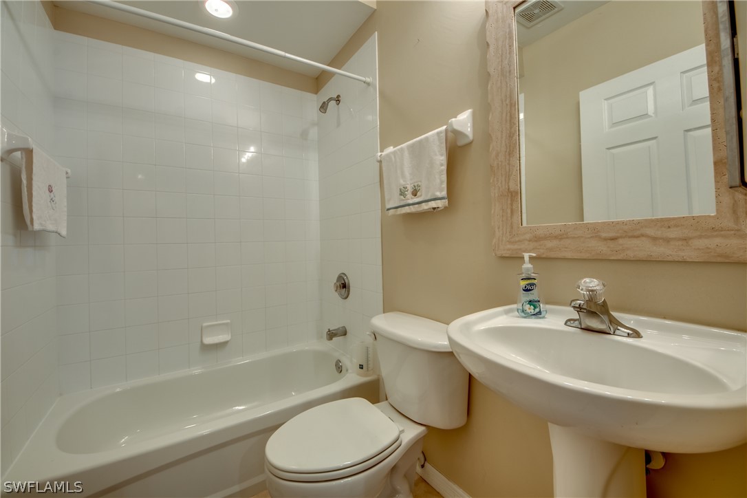 5180 Park Road, Unit 4 Fort Myers, FL 33908 - Photo 20 of 24 a bathroom with a sink toilet and shower