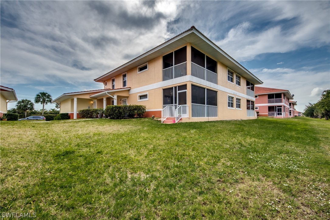 5180 Park Road, Unit 4 Fort Myers, FL 33908 - Photo 2 of 24 a front view of a house with garden