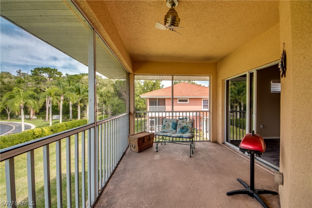 5180 Park Road, Unit 4 Fort Myers, FL 33908 - Photo 23 of 24 a view of a porch with a table and chairs