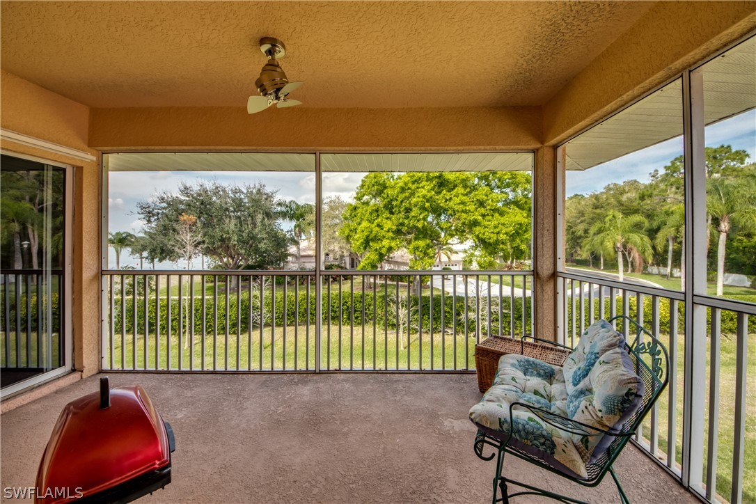 5180 Park Road, Unit 4 Fort Myers, FL 33908 - Photo 3 of 24 a living room with furniture and a floor to ceiling window