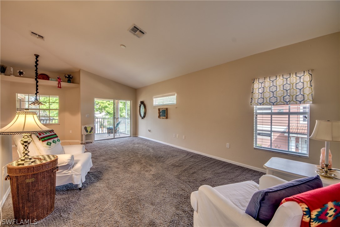 5180 Park Road, Unit 4 Fort Myers, FL 33908 - Photo 9 of 24 a living room with furniture and a large window