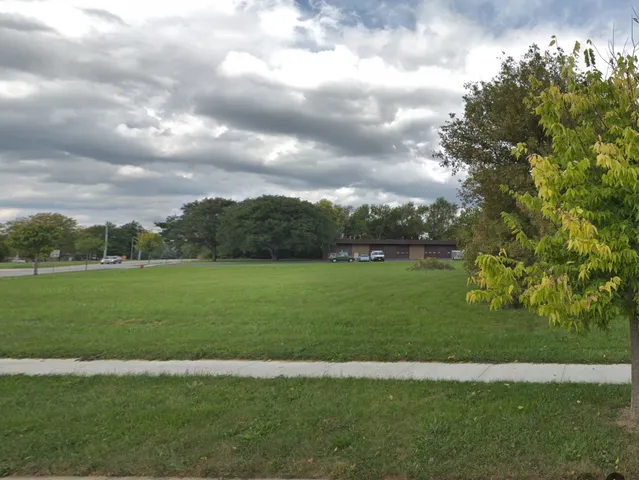 a view of a golf course with a garden