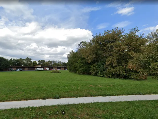 a view of a golf course with a lake