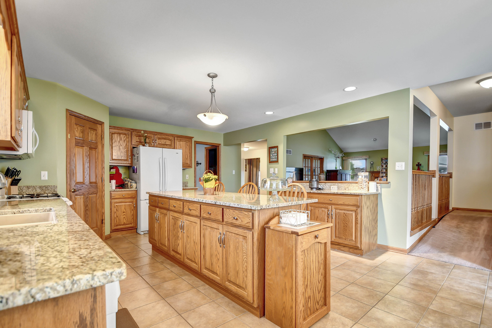 2012 Willow Brook Drive Bourbonnais, IL 60914 - Photo 13 of 33 a large kitchen with kitchen island a sink counter space and stainless steel appliances