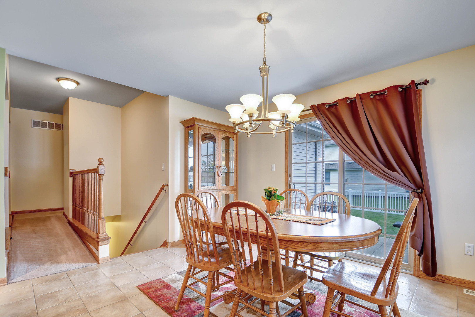 2012 Willow Brook Drive Bourbonnais, IL 60914 - Photo 16 of 33 a view of a dining room with furniture wooden floor and chandelier