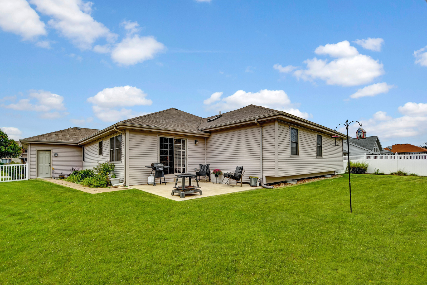 2012 Willow Brook Drive Bourbonnais, IL 60914 - Photo 28 of 33 a backyard of a house with table and chairs