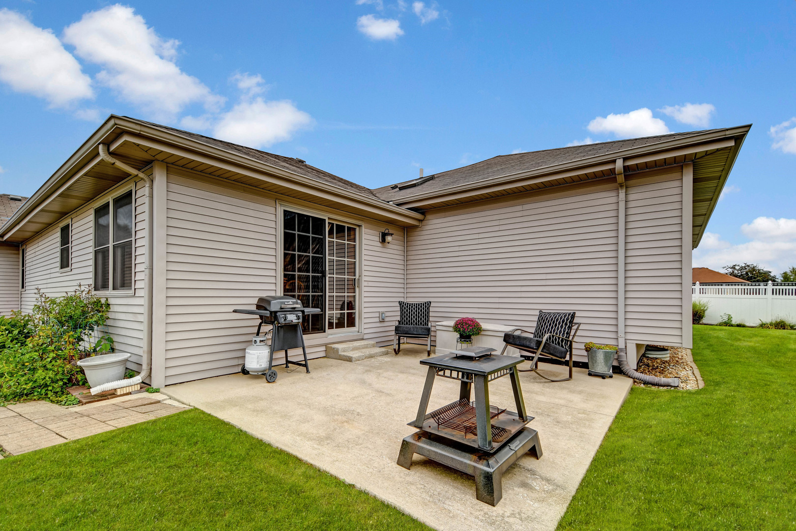 2012 Willow Brook Drive Bourbonnais, IL 60914 - Photo 29 of 33 a view of a backyard with furniture and a grill