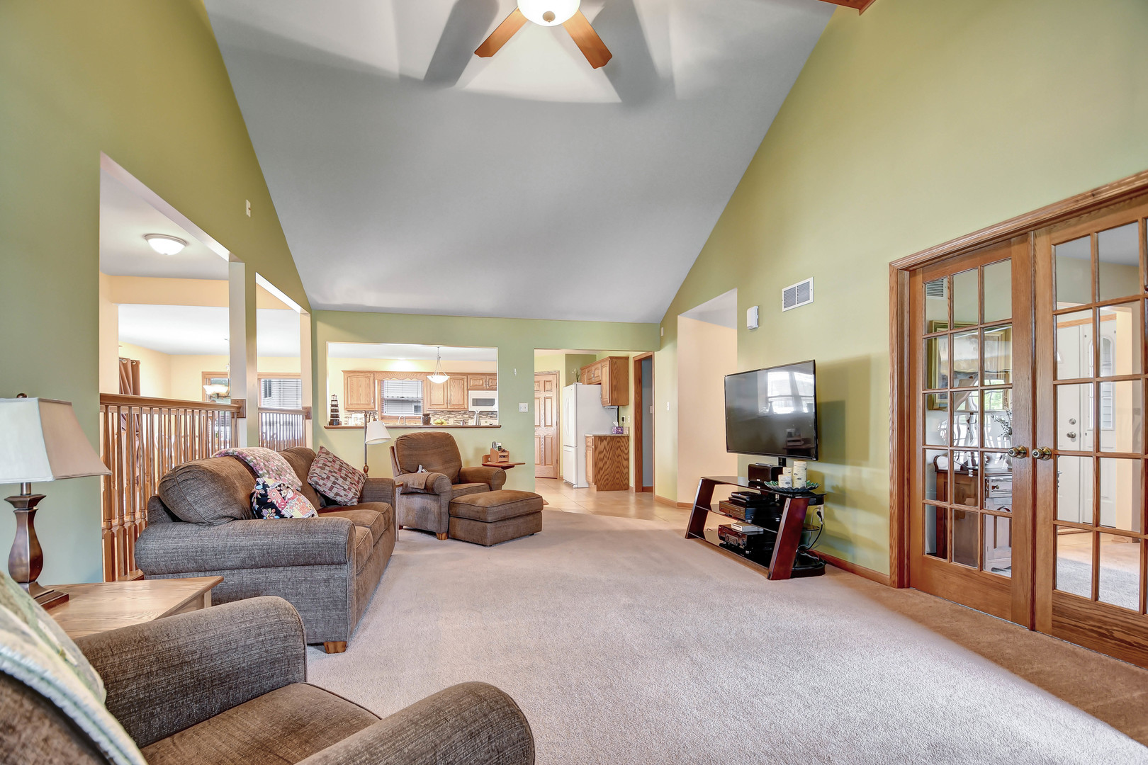 2012 Willow Brook Drive Bourbonnais, IL 60914 - Photo 8 of 33 a living room with furniture floor to ceiling window and a flat screen tv