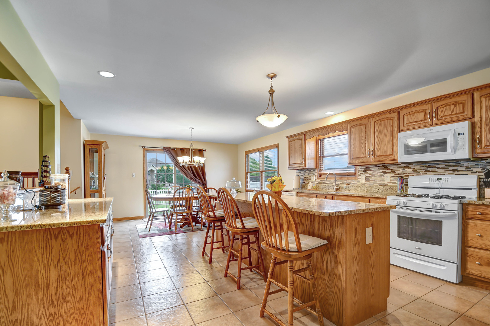 2012 Willow Brook Drive Bourbonnais, IL 60914 - Photo 9 of 33 a large kitchen with a table and chairs