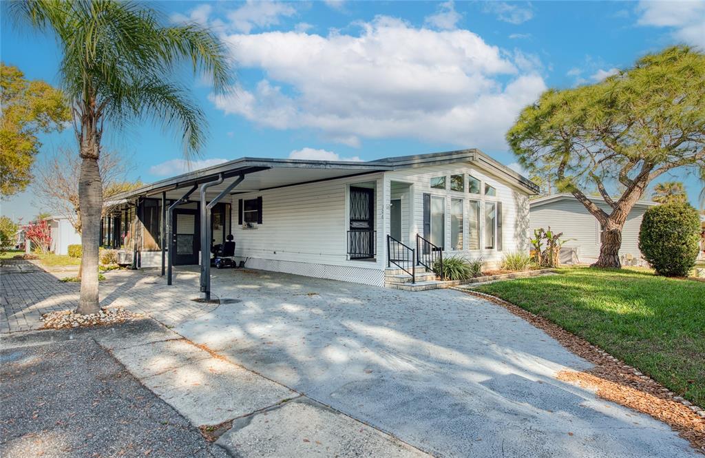 306 Snook Court Oldsmar, FL 34677 - Photo 1 of 1 a view of a house with backyard and tree s