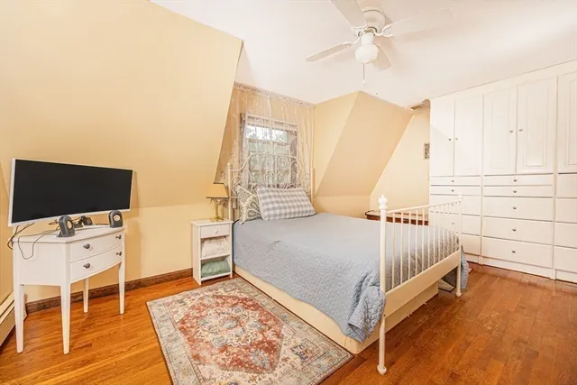 a view of a bedroom with furniture and windows