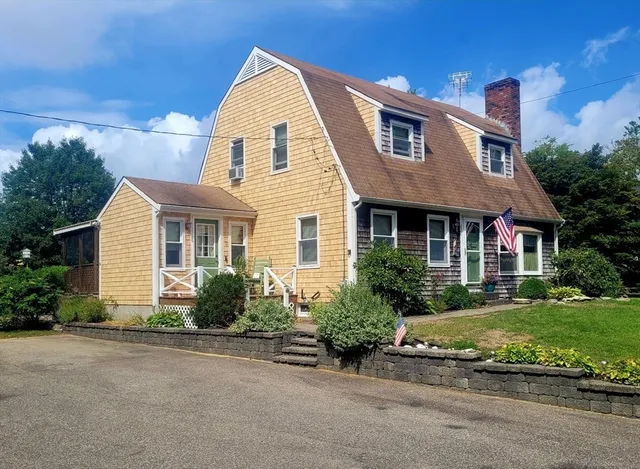 a front view of a house with a yard